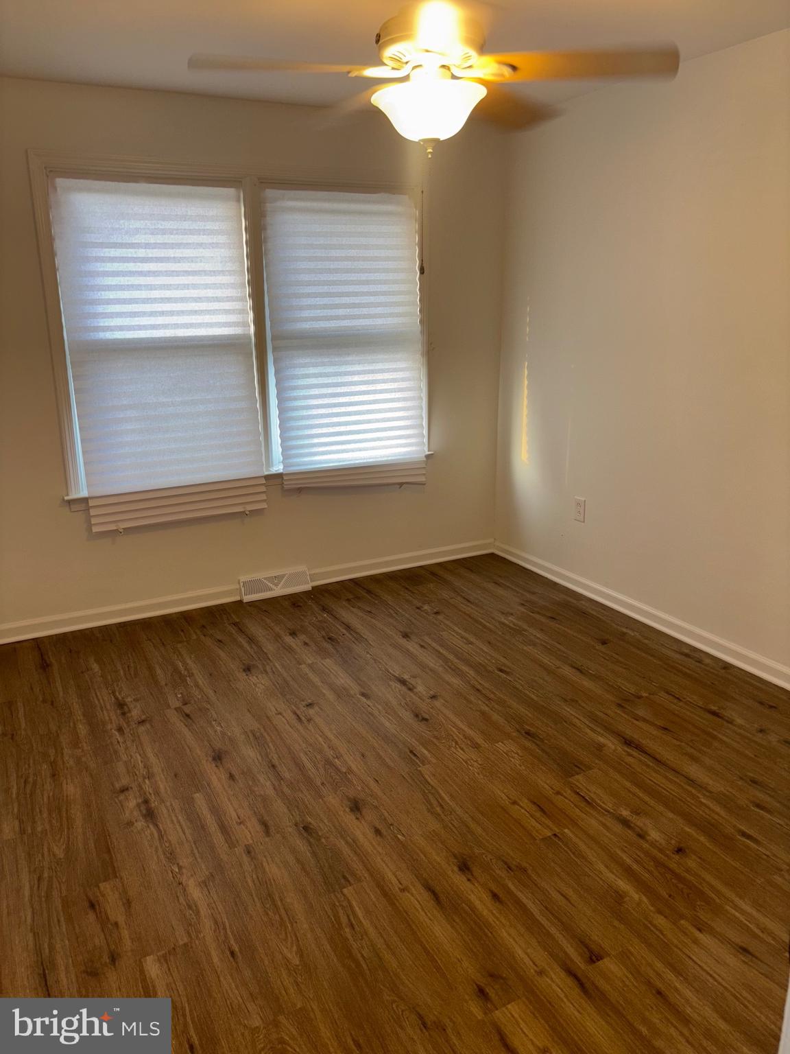 4216 West 7th Street Trainer, PA 19061 - Photo 17 of 26 a view of an empty room with wooden floor and a window