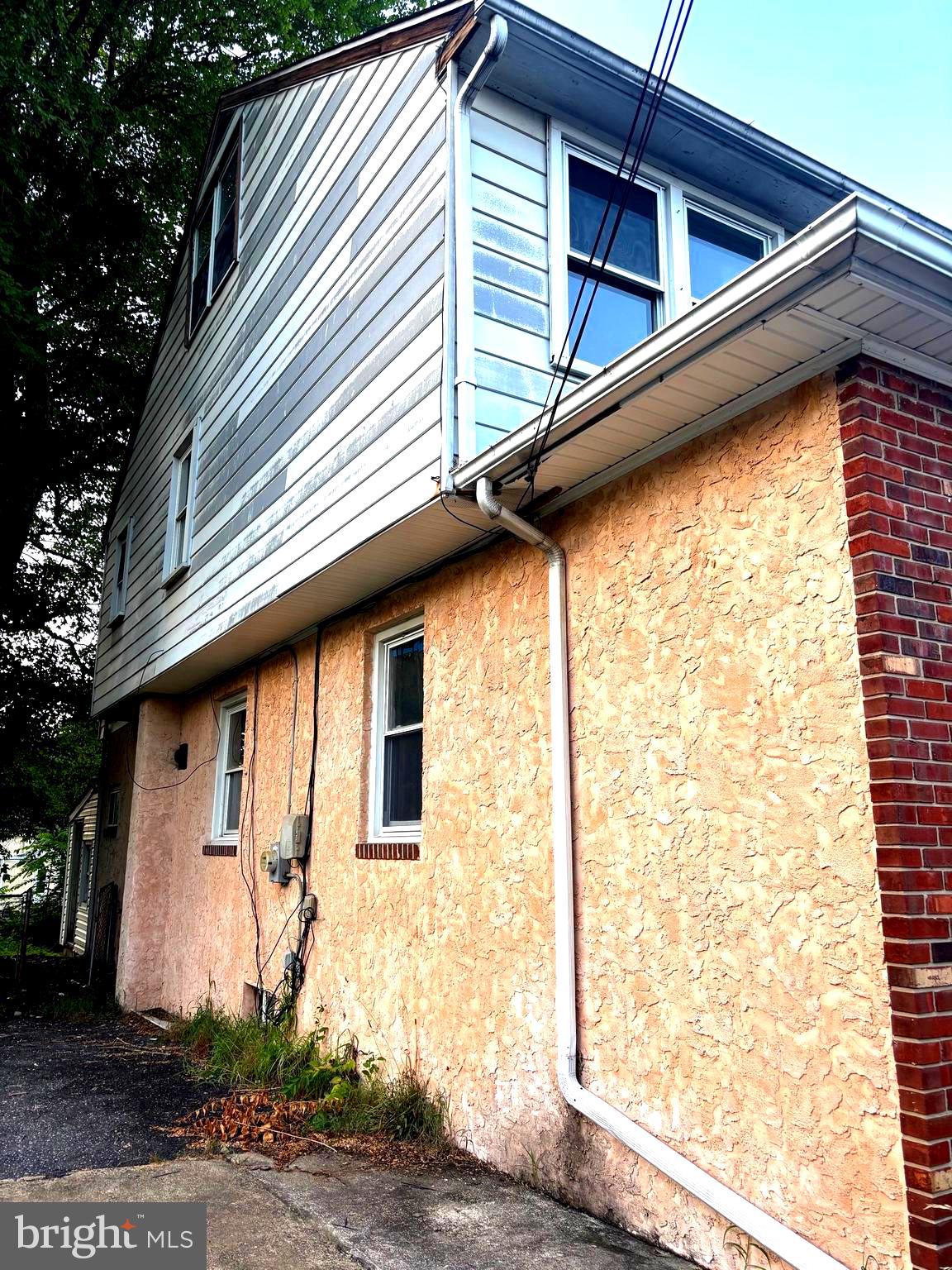 4216 West 7th Street Trainer, PA 19061 - Photo 24 of 26 a side view of a house with a yard