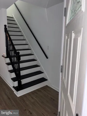 a view of entryway with wooden floor