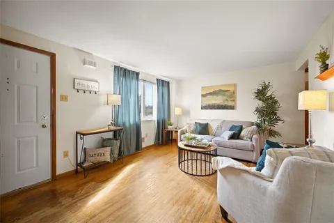 a living room with furniture and a table