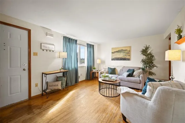 a living room with furniture and a table