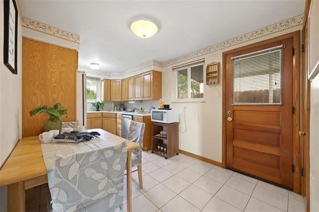 a kitchen with a refrigerator and a stove