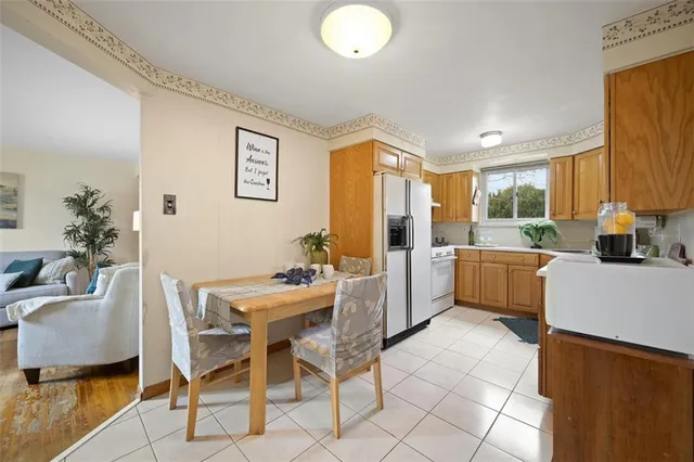 a view of a dining room with furniture and a window