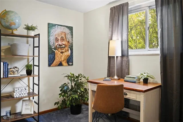 a dining room with furniture and window