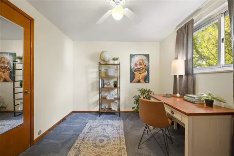 a workspace with furniture and window