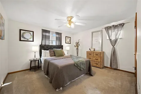 a bed room with furniture and a window