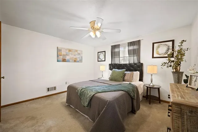 a bed room with a bed and a chandelier