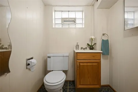 a chair and table in front of a house