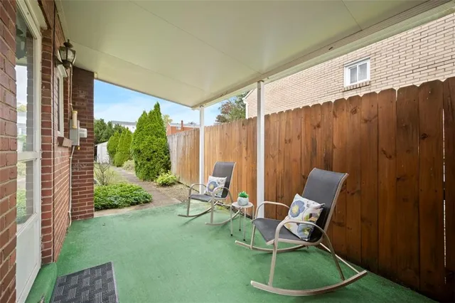 a view of a backyard with chairs
