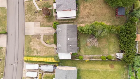 aerial view of a house with a swimming pool