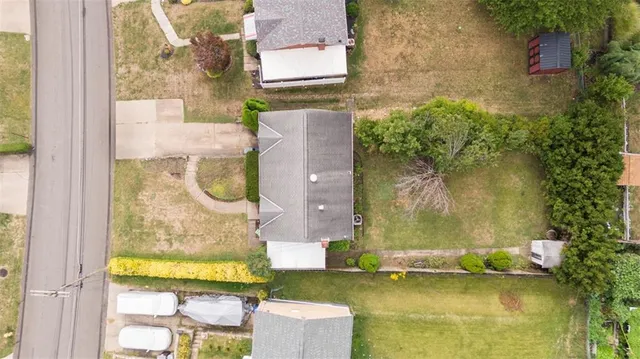 aerial view of a house with a swimming pool