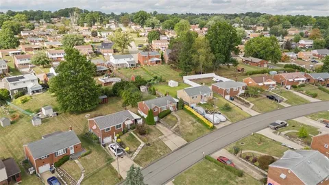 an aerial view of a city with lots of residential buildings