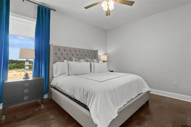 a bedroom with a bed and window