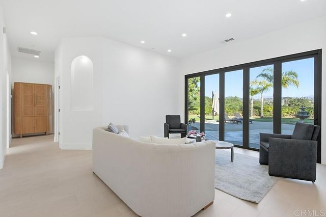 a bedroom with a bed dresser and a window