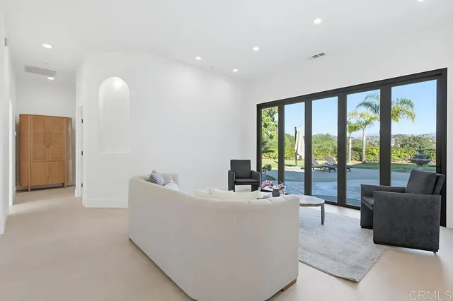 a bedroom with a bed dresser and a window