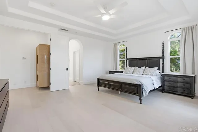 a bathroom with double sink and a mirror