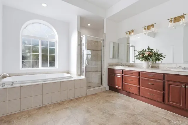 a white toilet sitting next to a white bath tub
