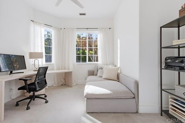 a front view of a house with swimming pool having outdoor seating