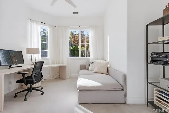 a front view of a house with swimming pool having outdoor seating