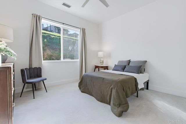 a view of a house with swimming pool and a garden