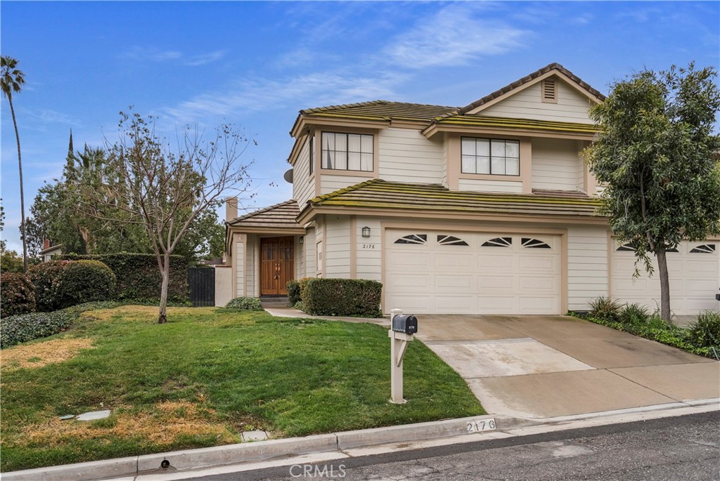 2176 Glenview Terrace Riverside, CA 92506 - Photo 1 of 36 a front view of a house with a yard and garage