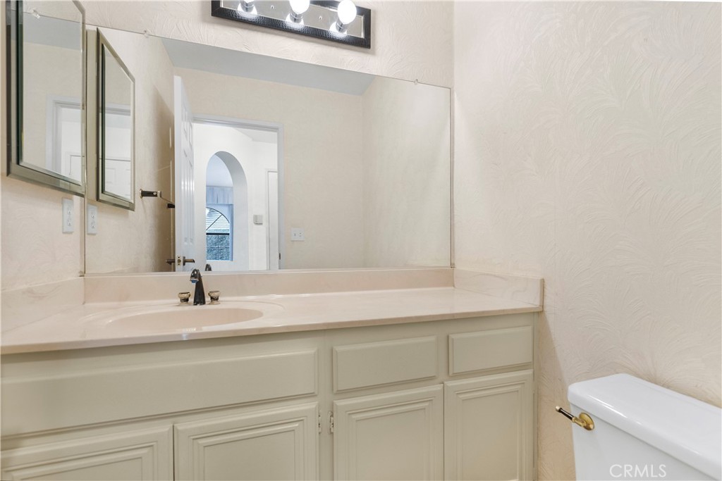 2176 Glenview Terrace Riverside, CA 92506 - Photo 16 of 36 a bathroom with a sink and a toilet