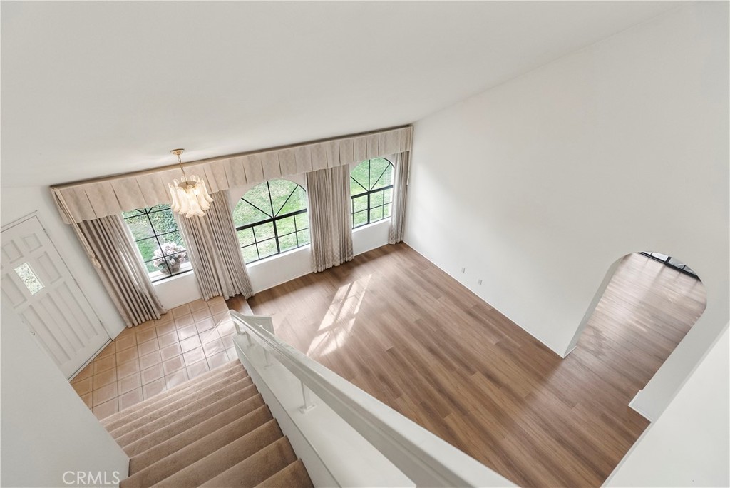 2176 Glenview Terrace Riverside, CA 92506 - Photo 17 of 36 a view of an empty room with wooden floor and a large window