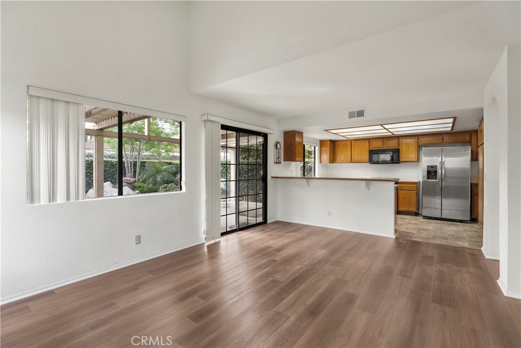 2176 Glenview Terrace Riverside, CA 92506 - Photo 10 of 36 a view of a kitchen with wooden floor and a kitchen