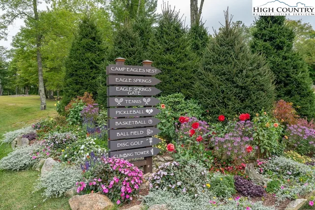 a view of a flower garden in front of house