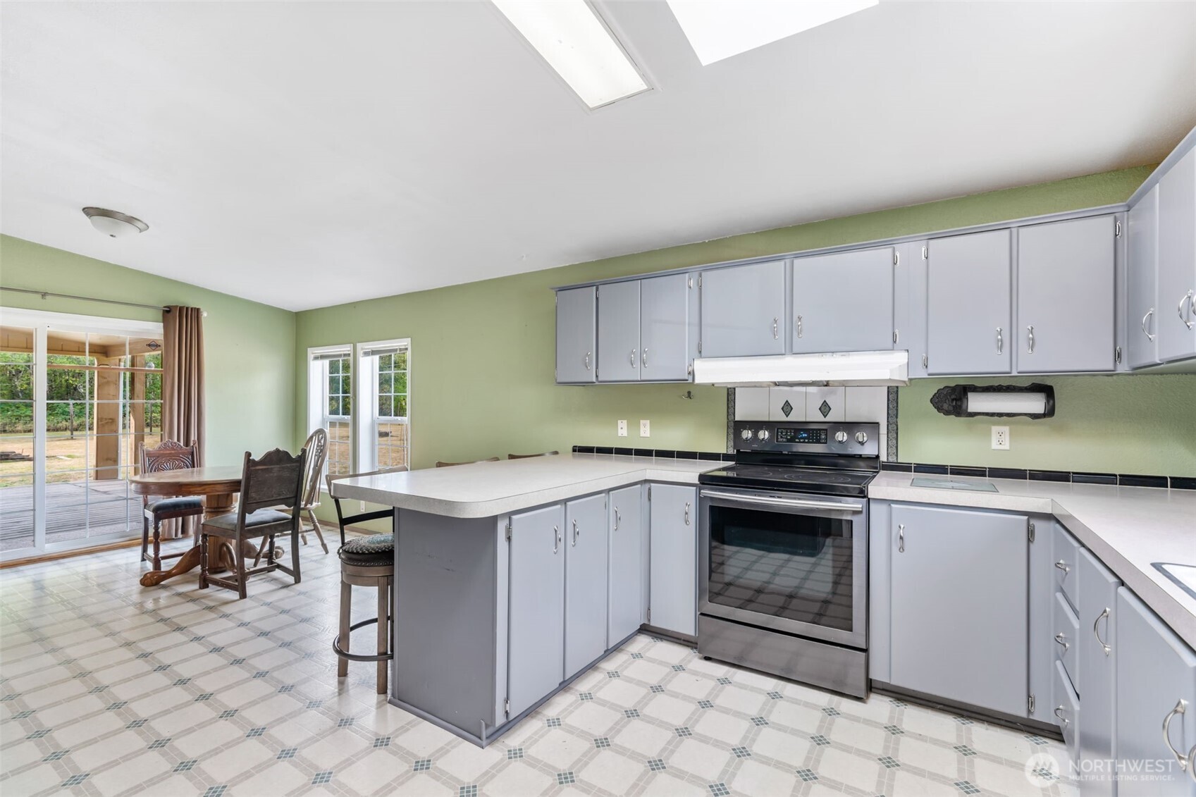 1332 Centralia Alpha Road Chehalis, WA 98532 - Photo 25 of 40 a kitchen with a stove sink and cabinets