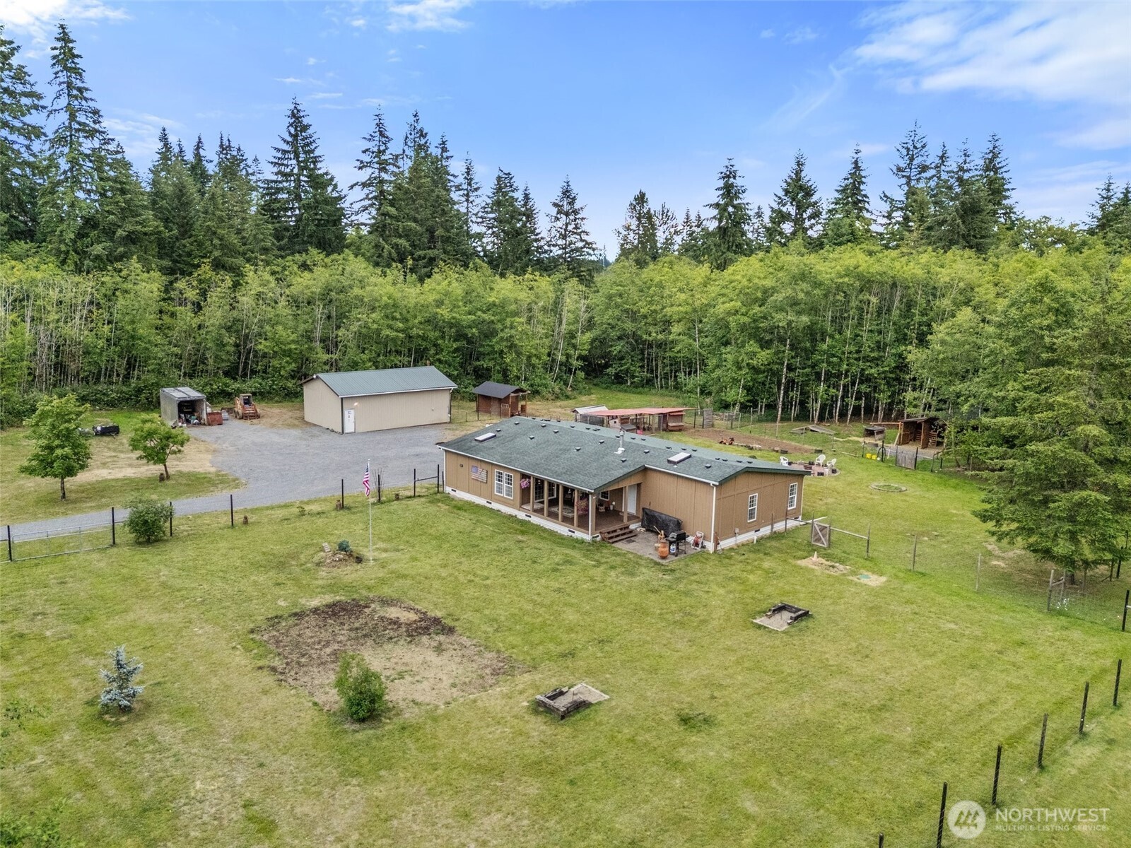 1332 Centralia Alpha Road Chehalis, WA 98532 - Photo 5 of 40 a view of a house with garden and trees