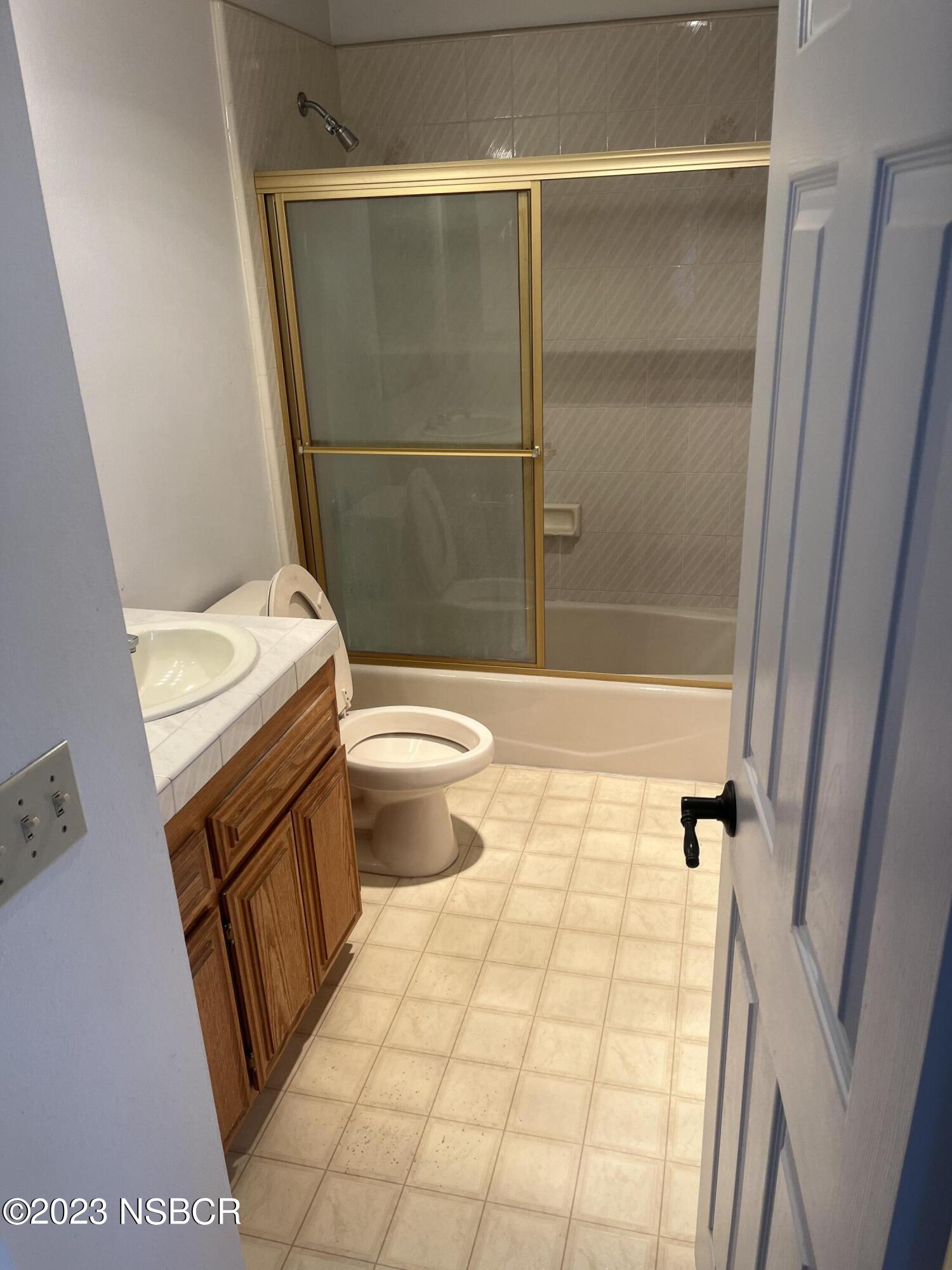 1674 Eucalyptus Drive, Unit C Solvang, CA 93463 - Photo 6 of 7 a bathroom with a sink toilet and shower