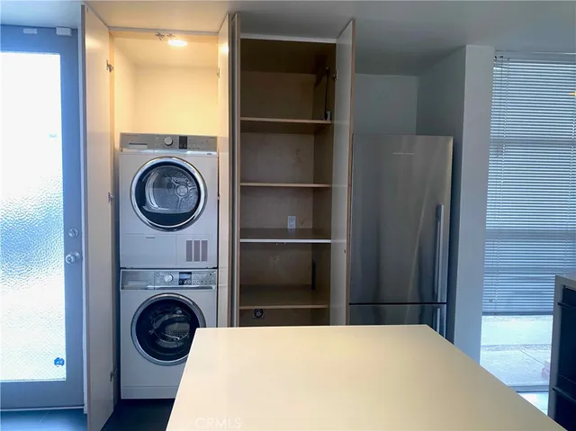 a view of a kitchen with washer and dryer