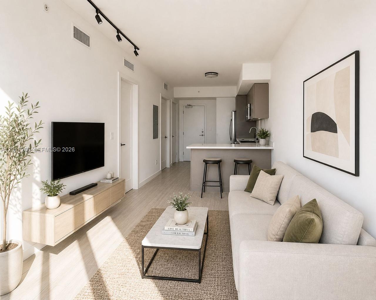 321 Northeast 26th Street, Unit 515 Miami, FL 33137 - Photo 3 of 7 a living room with furniture and a flat screen tv