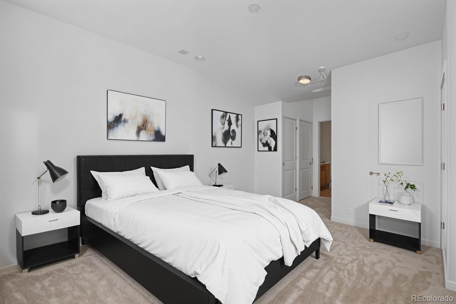 4100 Albion Street, Unit 320 Denver, CO 80216 - Photo 12 of 45 a bedroom with a bed and a couch