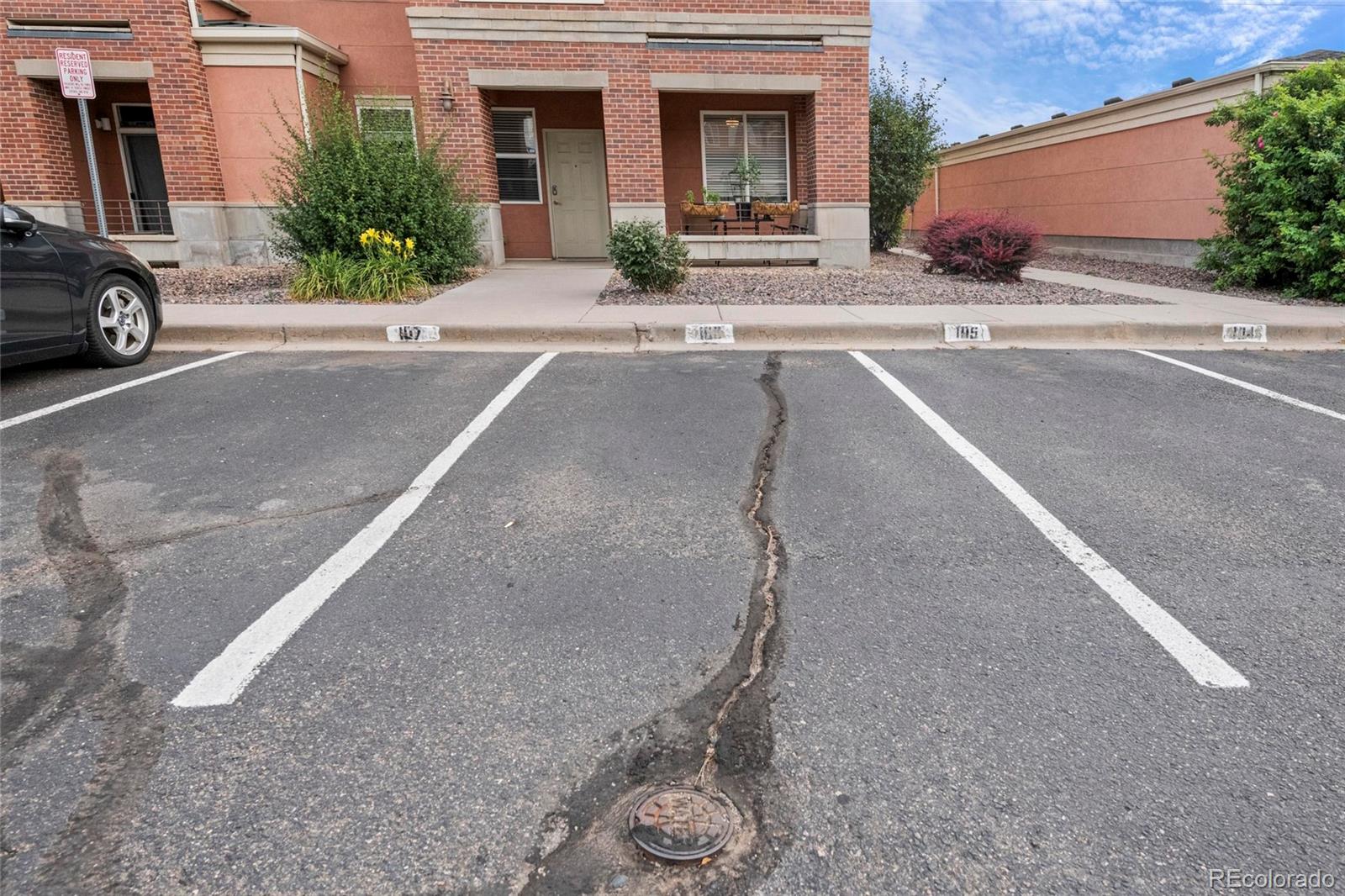 4100 Albion Street, Unit 320 Denver, CO 80216 - Photo 29 of 45 front view of a house with a street