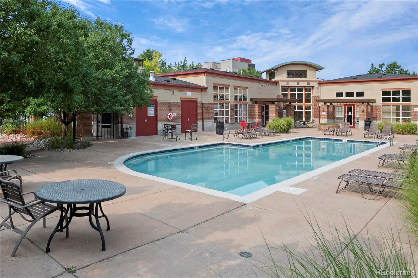 4100 Albion Street, Unit 320 Denver, CO 80216 - Photo 35 of 45 a view of a house with swimming pool and sitting area