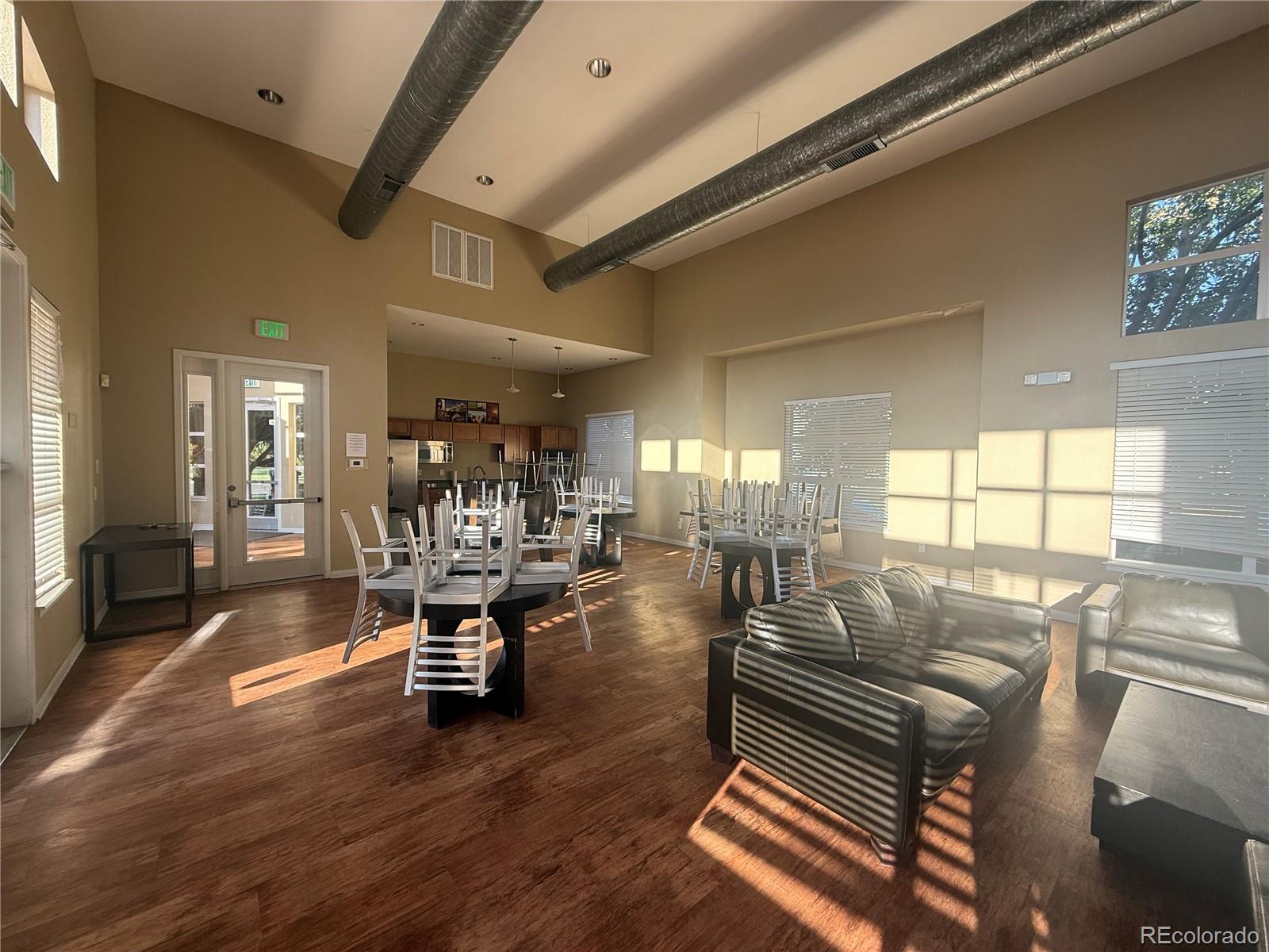4100 Albion Street, Unit 320 Denver, CO 80216 - Photo 39 of 45 a living room with furniture and a large window