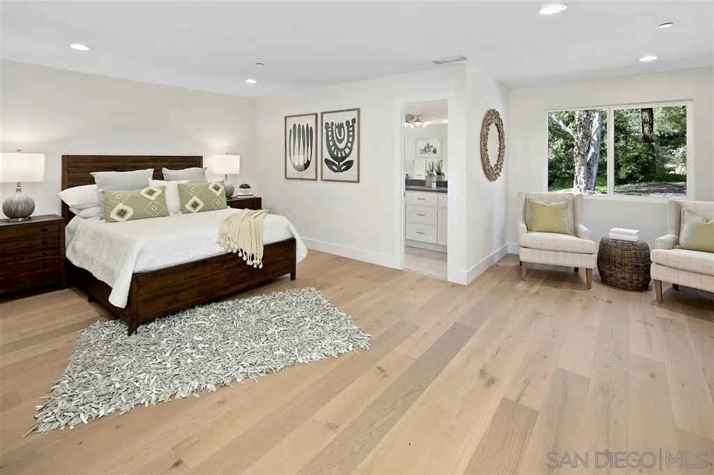 17502 Rancho Del Rio Rancho Santa Fe, CA 92067 - Photo 11 of 20 a living room with a bed furniture and a window