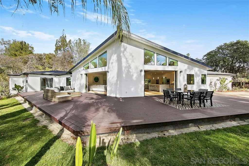 17502 Rancho Del Rio Rancho Santa Fe, CA 92067 - Photo 12 of 20 a view of house with backyard and outdoor seating