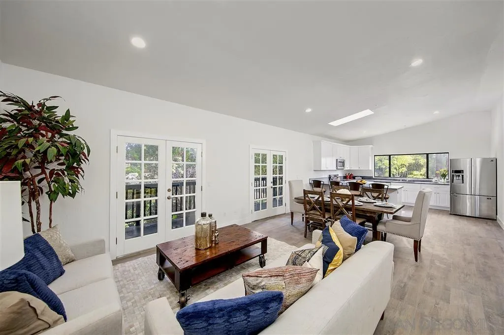 17502 Rancho Del Rio Rancho Santa Fe, CA 92067 - Photo 16 of 20 a living room with furniture and a potted plant