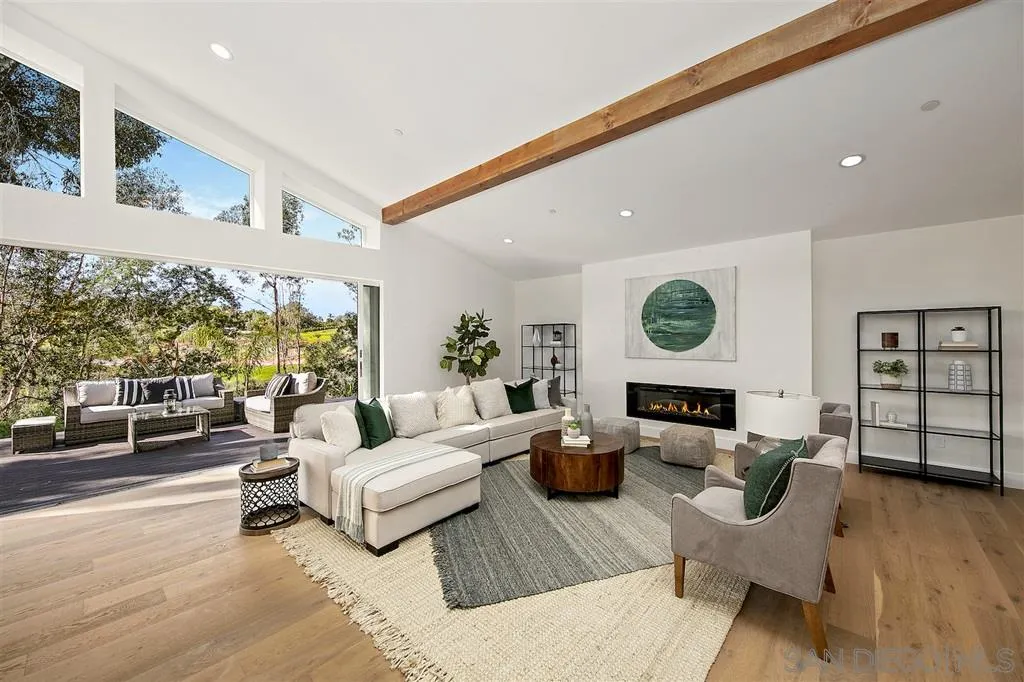 17502 Rancho Del Rio Rancho Santa Fe, CA 92067 - Photo 4 of 20 a living room with furniture and a large window