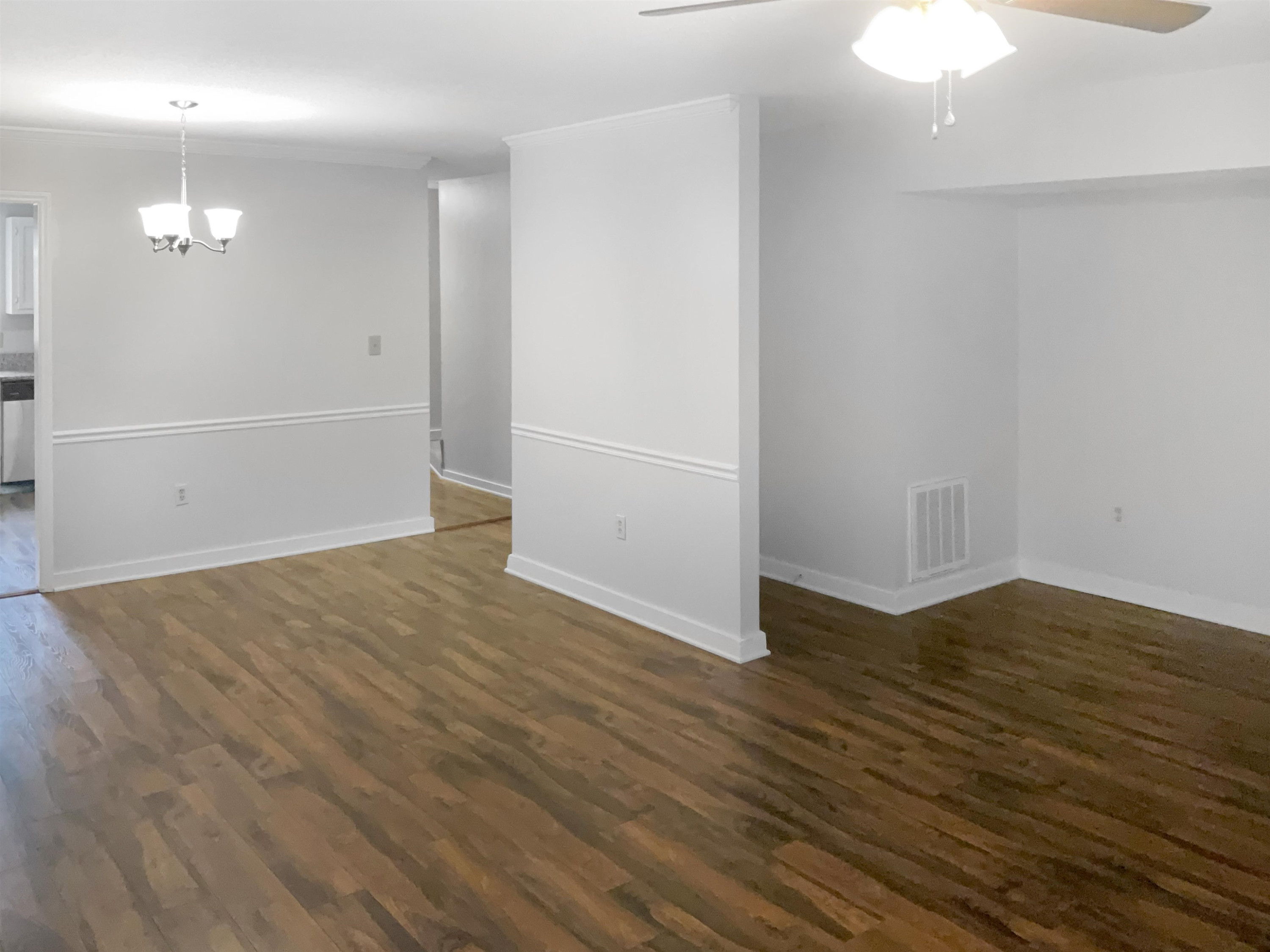 46 Willow Bridge Drive Durham, NC 27707 - Photo 11 of 29 an empty room with wooden floor and windows