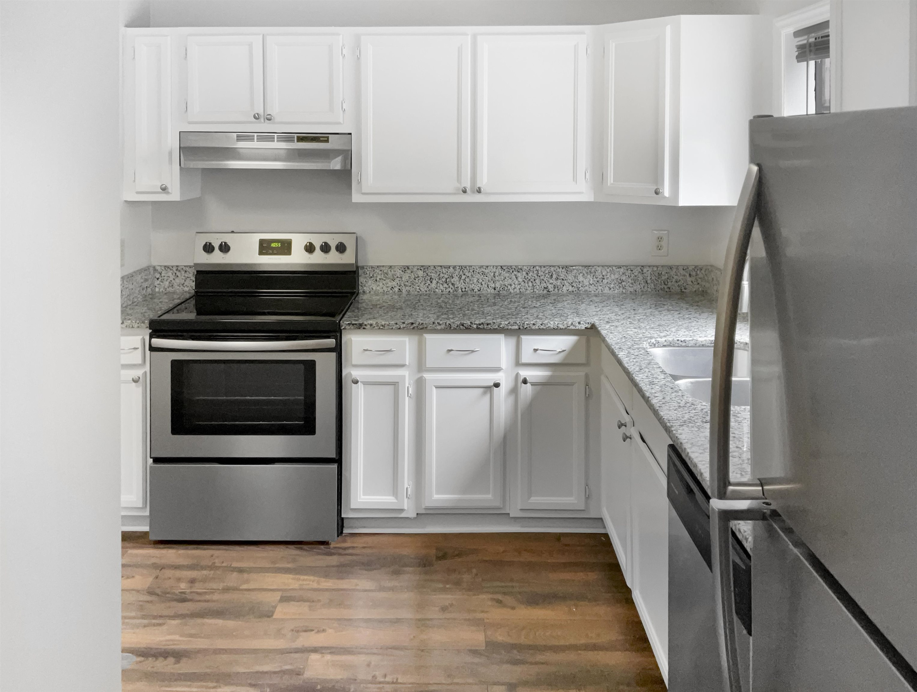 46 Willow Bridge Drive Durham, NC 27707 - Photo 7 of 29 a kitchen with stainless steel appliances granite countertop a stove a microwave and a refrigerator