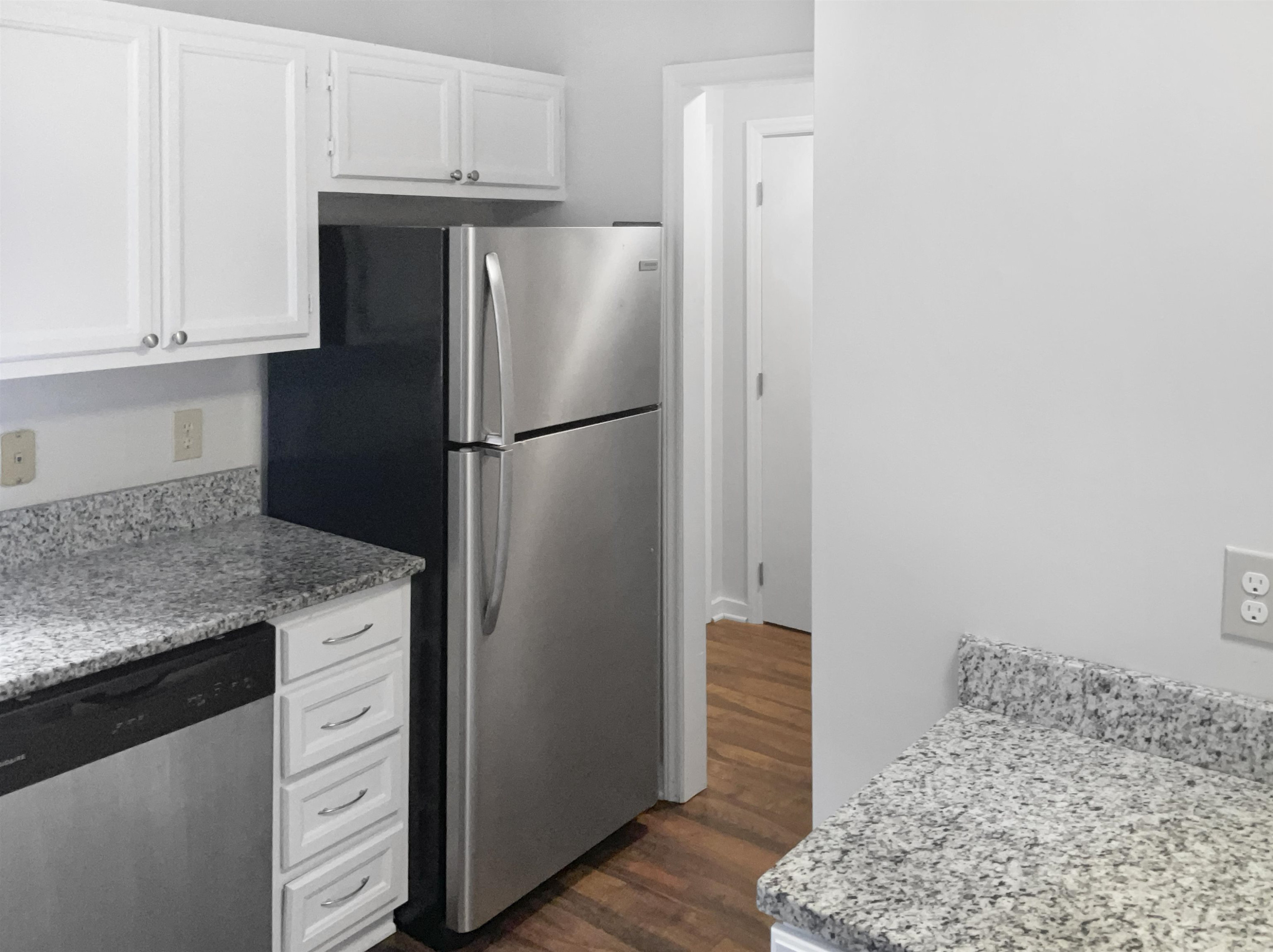 46 Willow Bridge Drive Durham, NC 27707 - Photo 9 of 29 a kitchen with a refrigerator and cabinets