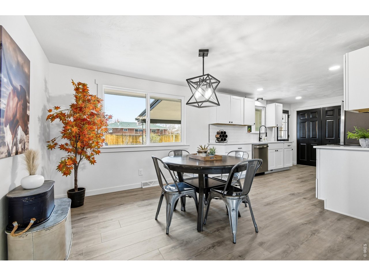 1239 Sunset Street Longmont, CO 80501 - Photo 15 of 34 a view of a dining room with furniture and wooden floor