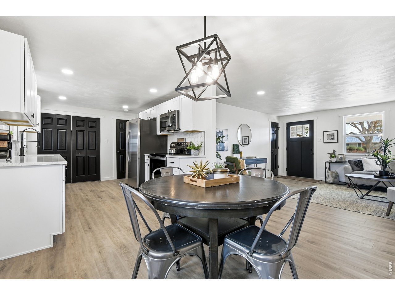 1239 Sunset Street Longmont, CO 80501 - Photo 17 of 34 a view of a dining room with furniture and wooden floor