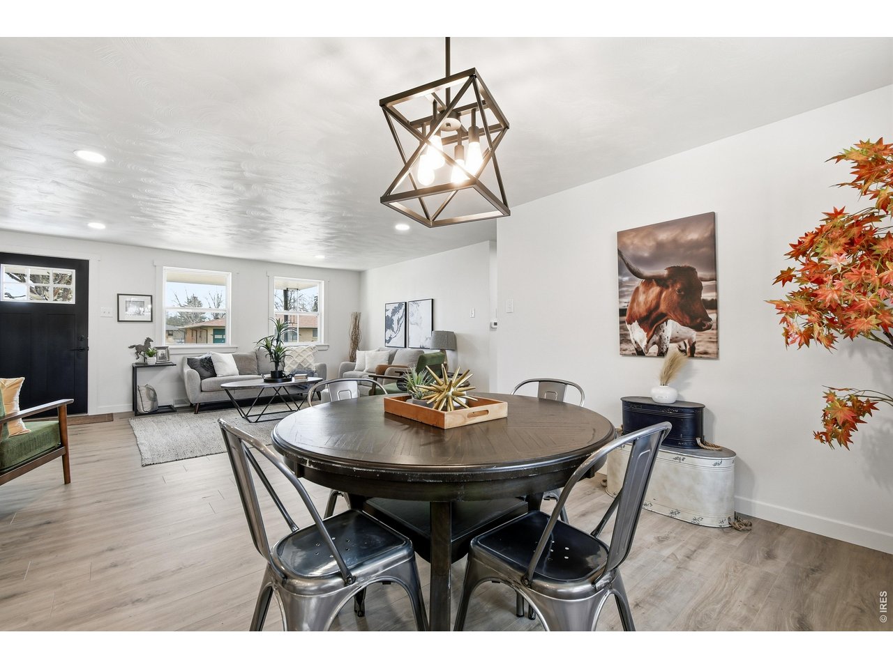 1239 Sunset Street Longmont, CO 80501 - Photo 18 of 34 a view of a dining room with furniture and wooden floor