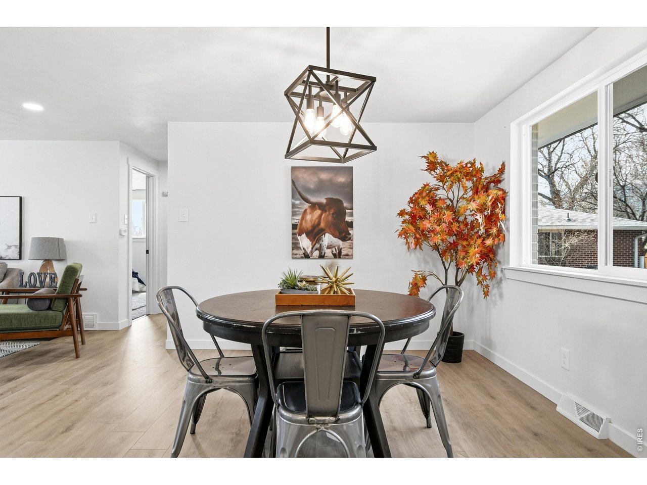 1239 Sunset Street Longmont, CO 80501 - Photo 19 of 34 a dining room with furniture window and wooden floor