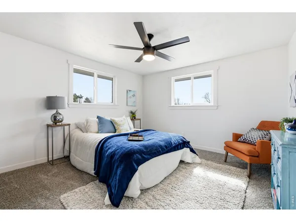 a bed room with a bed and a couch